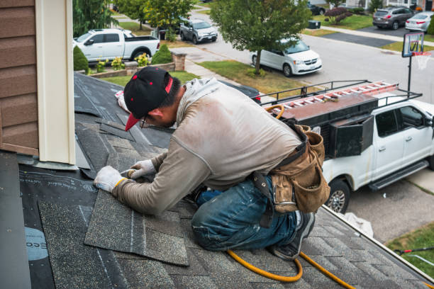 Professional Roofing technician working in West Kingston, RI